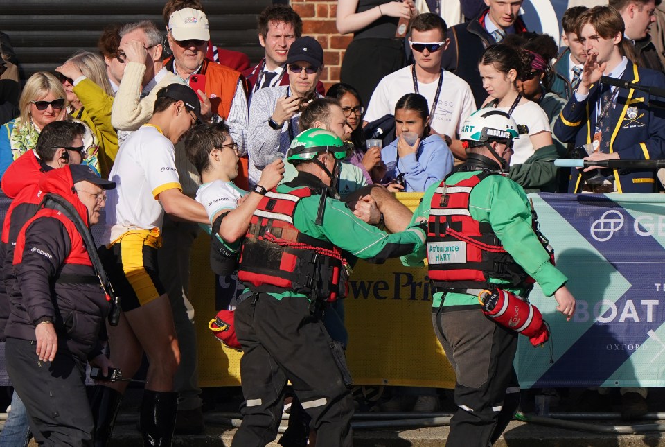 Exhausted Cambridge rower Matt Edge had to be carried away by paramedics after crossing the finish line