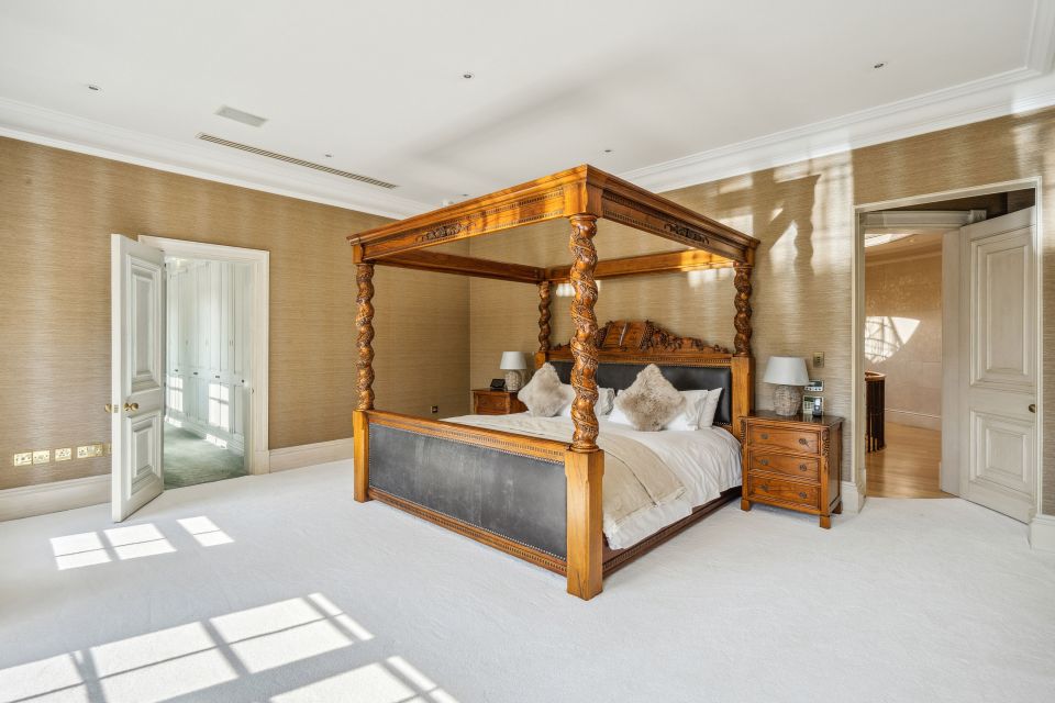 The four-poster bed in the couple's master bedroom