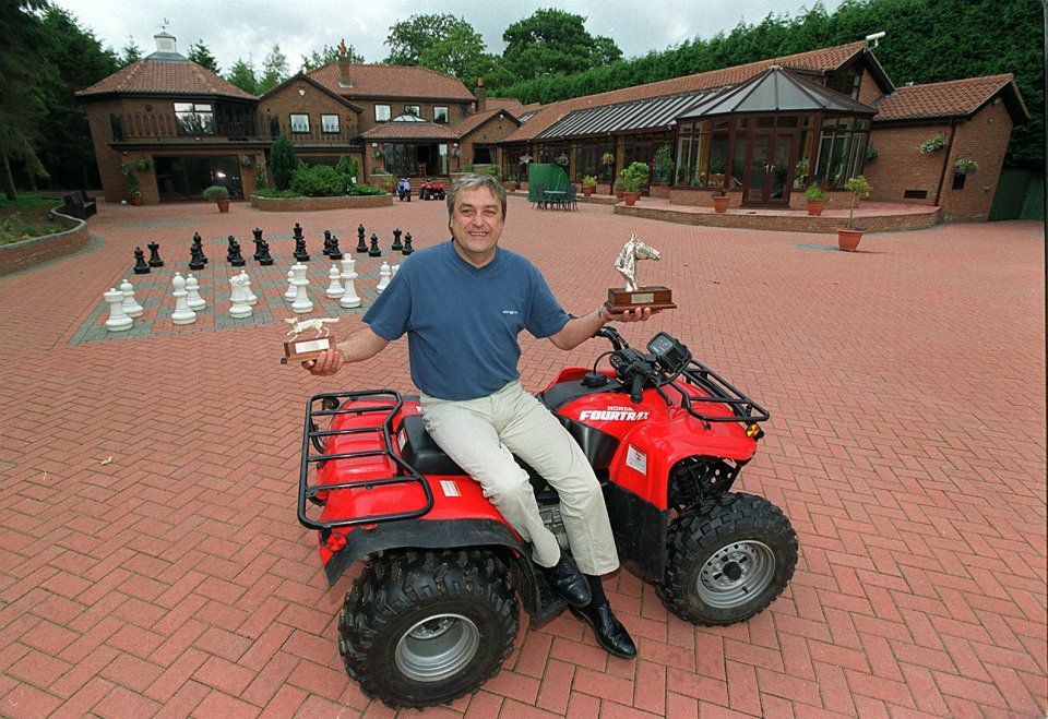 Roy with two trophies his racing horse won for him