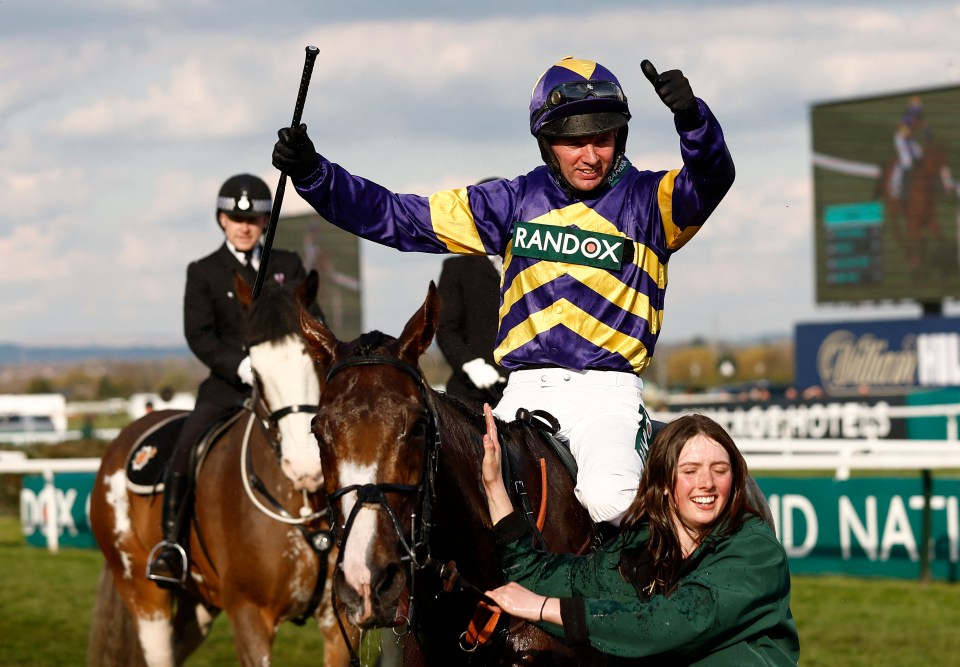 Jockey Fox celebrates winning the Grand National on 8-1 favourite Corach Rambler