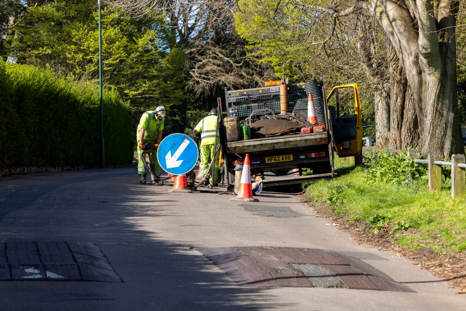 Workers setting up on the road