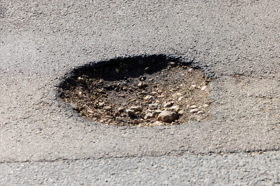 One of the many potholes on the seaside street