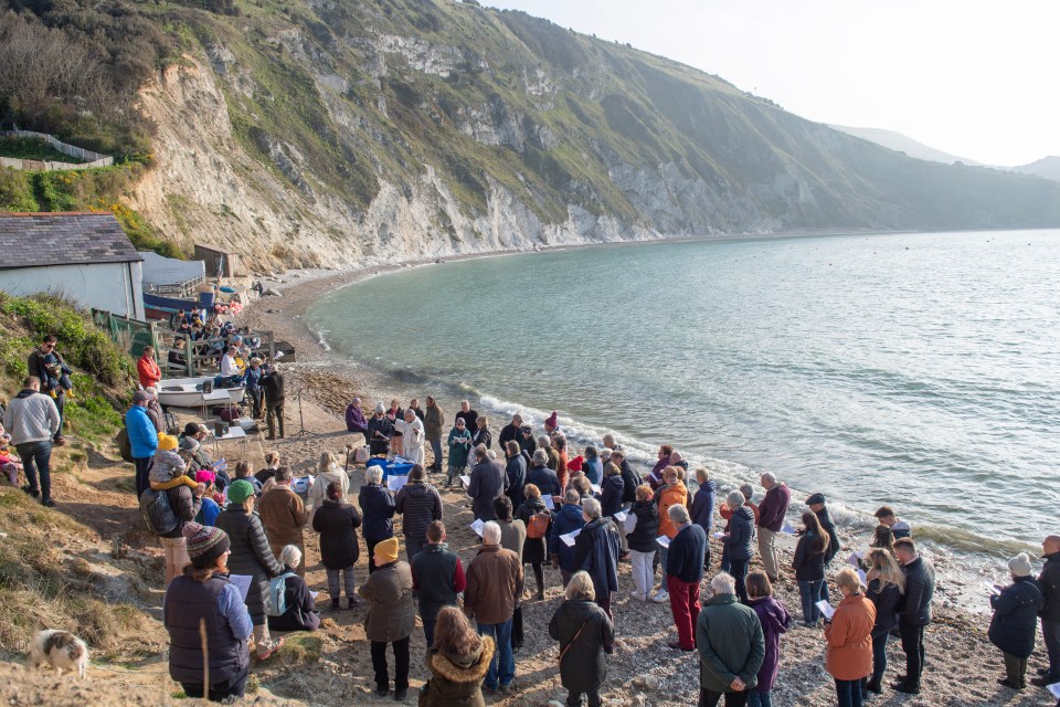 An Easter Sunday church service taking place on Lulworth Cove