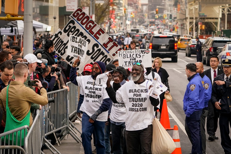 Supporters of the ex-President make there thoughts clear with placards and T-shirts