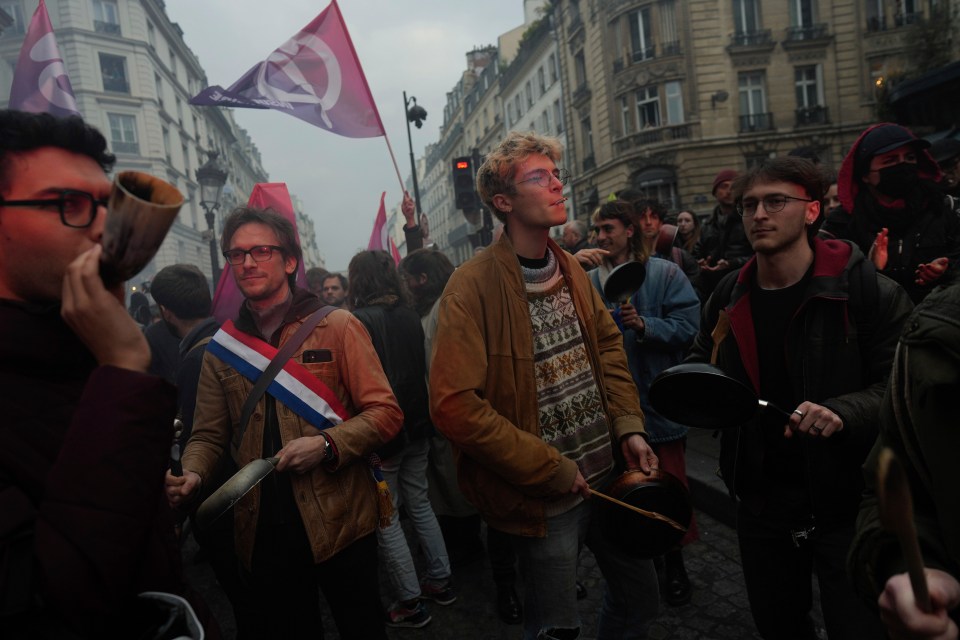 Hundreds of people took to the streets of Paris within minutes of Macron speaking to the nation in a TV address