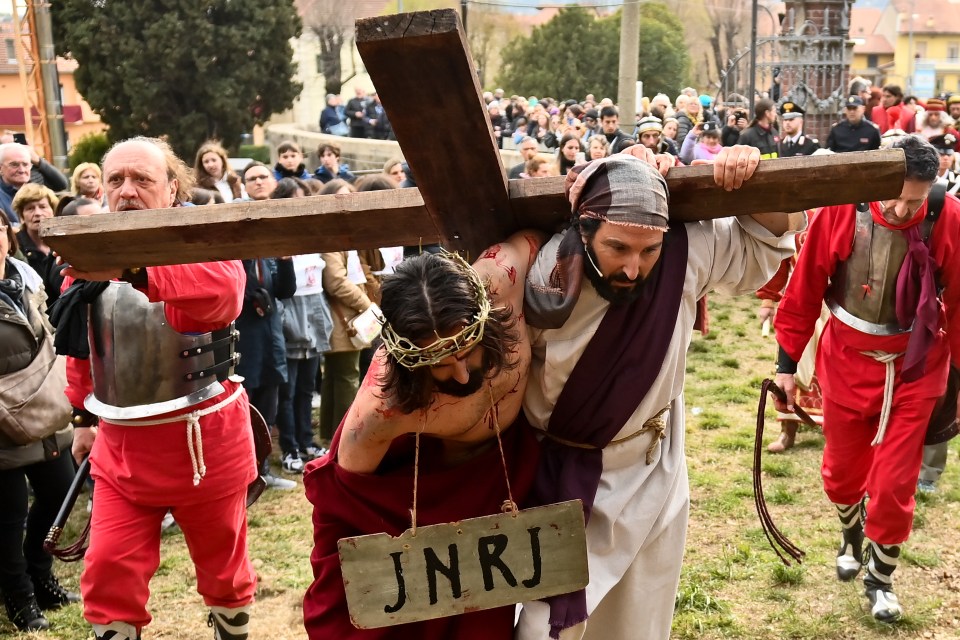 In Italy, Jesus is helped by a friend to carry the cross