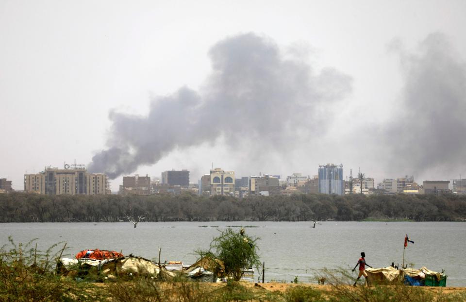 A military vehicle and soldiers are seen on a street of Khartoum, Sudan, April 15, 2023 in this scren grab obtained from a social media video. Mohammadkhair Abdualrhman/via REUTERS THIS IMAGE HAS BEEN SUPPLIED BY A THIRD PARTY. MANDATORY CREDIT. NO RESALES. NO ARCHIVES.