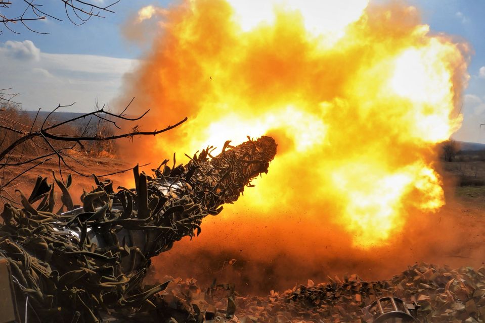 A Ukrainian T-72 tank fires at Russian positions on the front line near Bakhmut