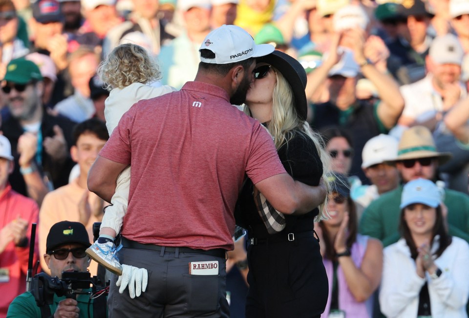 Rahn celebrated with wife Kelley and son Kepa on the 18th green