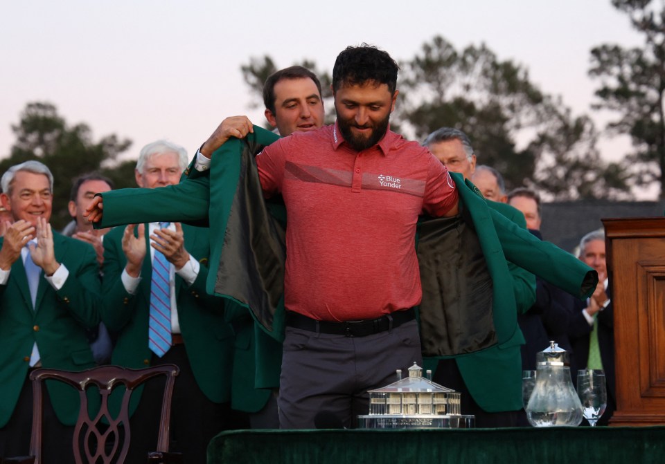 Rahm was presented with his iconic Green Jacket by last year's winner Scottie Scheffler