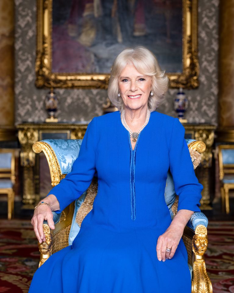 Camilla was dressed in blue and wore a set of The Queen's pearl drop earrings