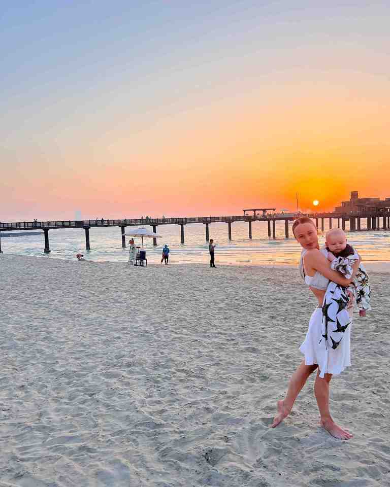 Jorgie Porter cuddled her son Forrest as the sun set on her holiday