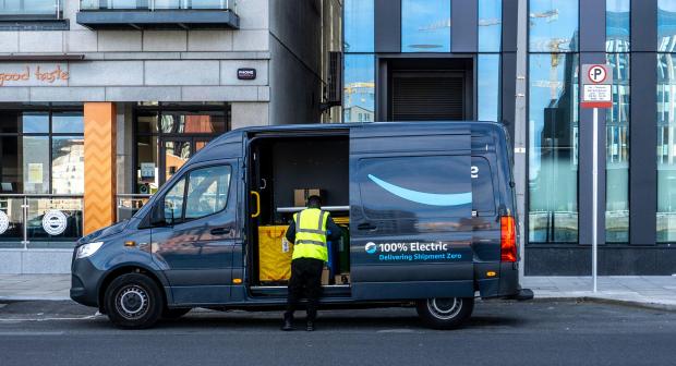 2GWK7DN An Amazon delivery van, A Mercedes eSprinter electric van, delivering parcels on the South Quays of the River Liffey in Dublin, Ireland.