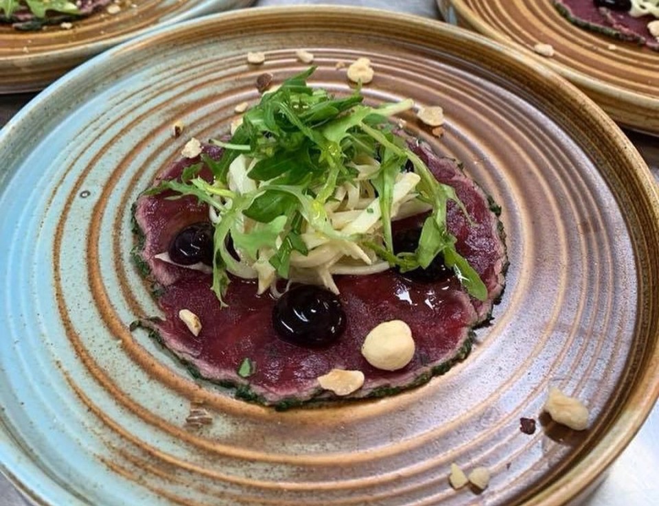 The restaurant plates up delicious meals, including its beef carpaccio