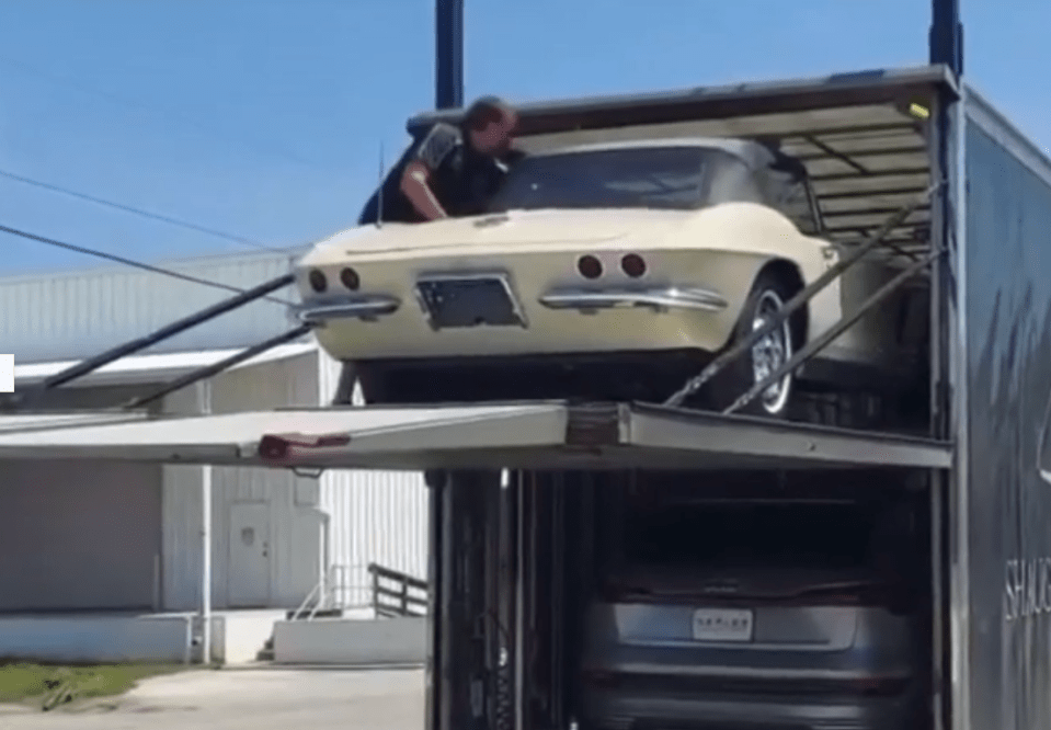 A shocking video shows the moment a classic £150,000 Chevrolet Corvette takes a tumble off a car transporter