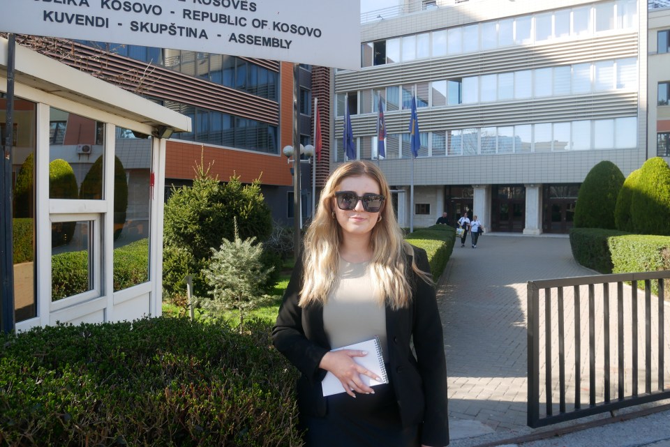 The Sun's Sarah Hooper outside of the Kosovo Parliament building