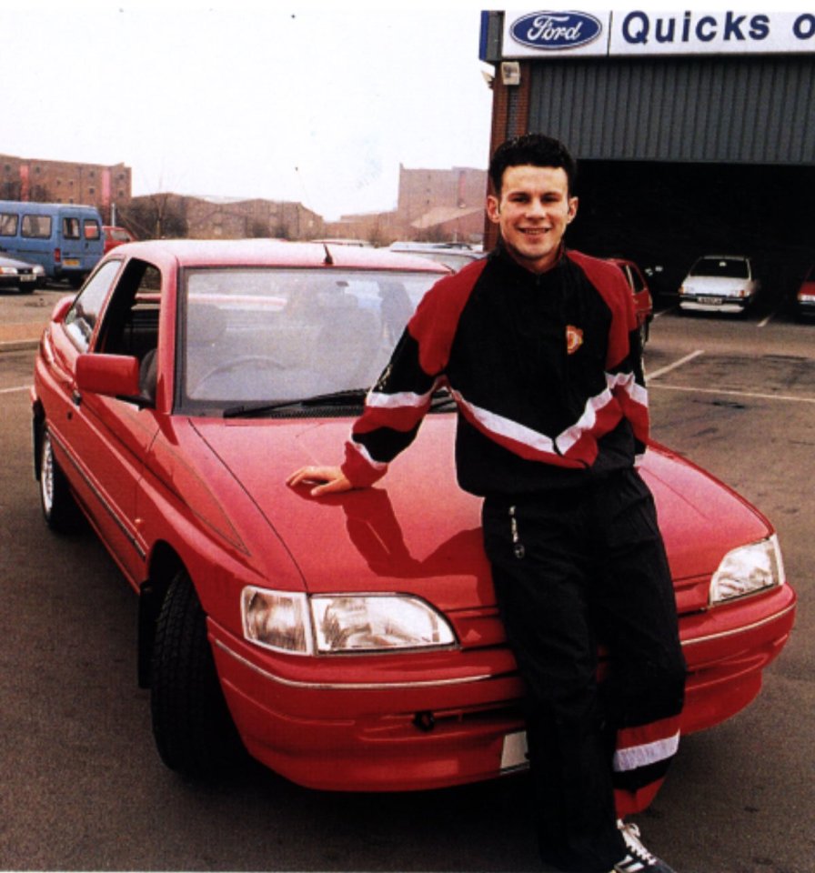 Headline: BECKS' £687,090 CAR BOOTY<br />
Caption: STEER WE GO: Beckham hit the road in the Red Devils' Ford Escort<br />
COLLECT BY EAMONN CLARK....RYAN GIGGS WITH HIS FORD ESCORT MEXICO WHICH WAS LATER GIVEN TO DAVID BECKHAM