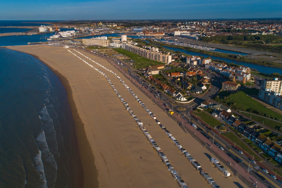 There are lots of beach huts lining the sand too