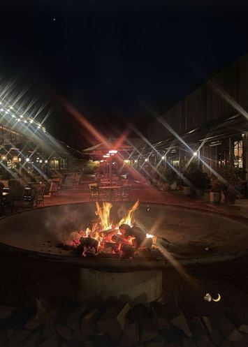 The girls kept warm around a firepit under the stars