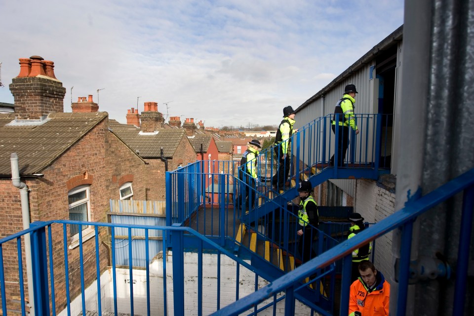 Stairs lead up to the Oak Stand, running above residents' gardens