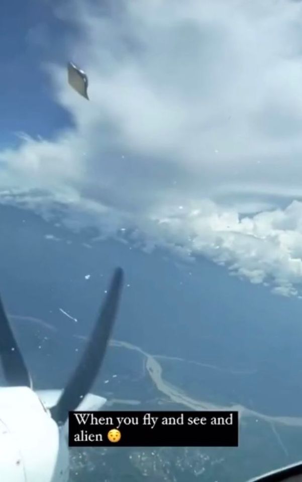 The moment the bizarre craft flies past the cockpit of an airplane