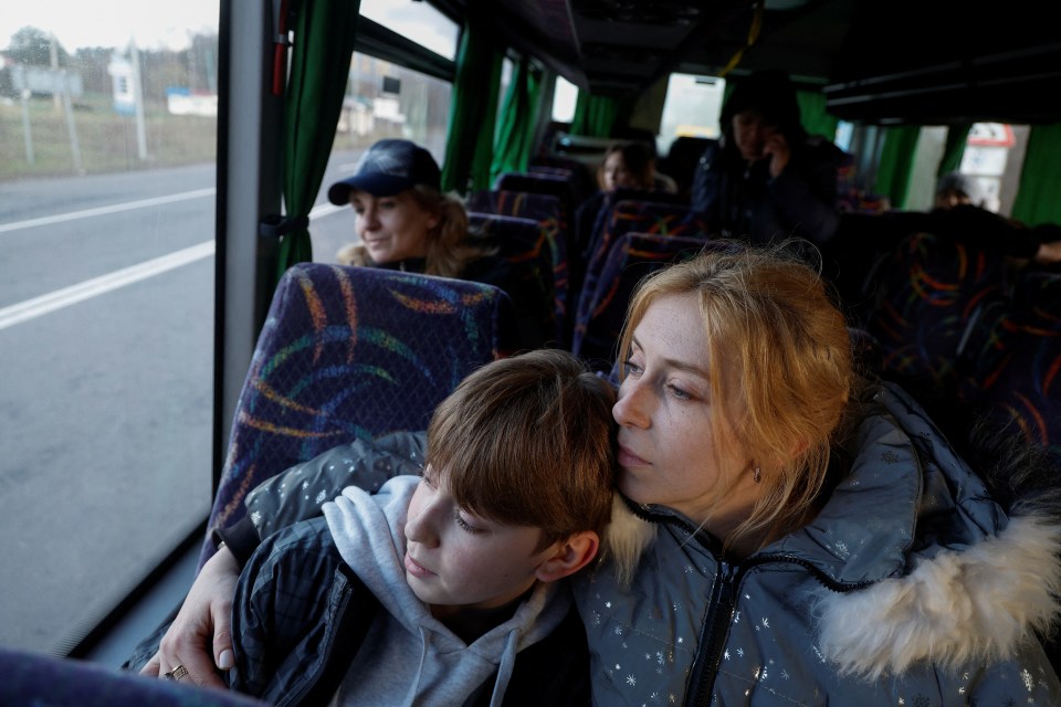 Alla Yatsentiuk embraces her son Danylo, 14