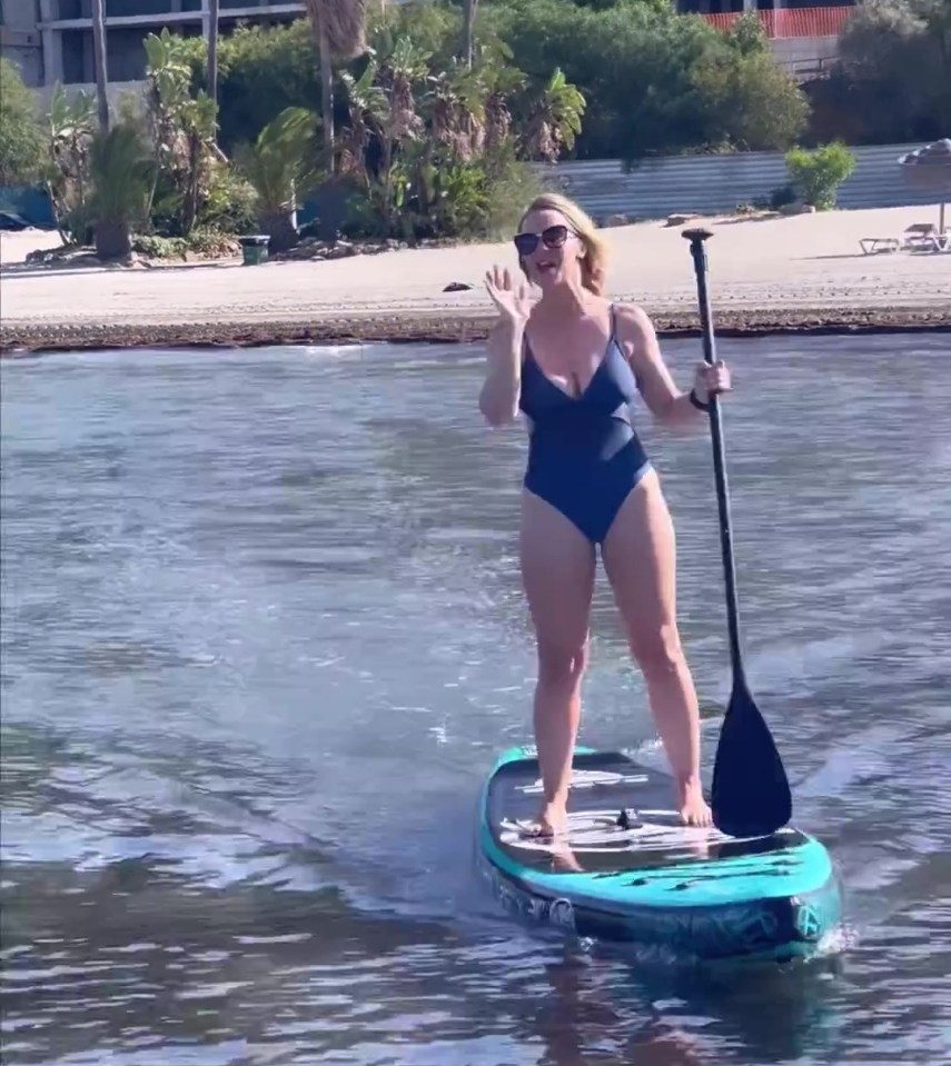 The property expert showcased her trim figure on a paddleboard