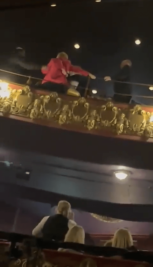 Footage shows a woman being dragged out of the Palace Theatre in Manchester