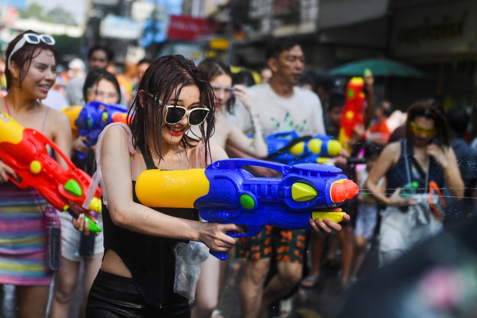 The most iconic aspect of Songkran is the water splashing, symbolizing purification and the washing away of sins and bad luck