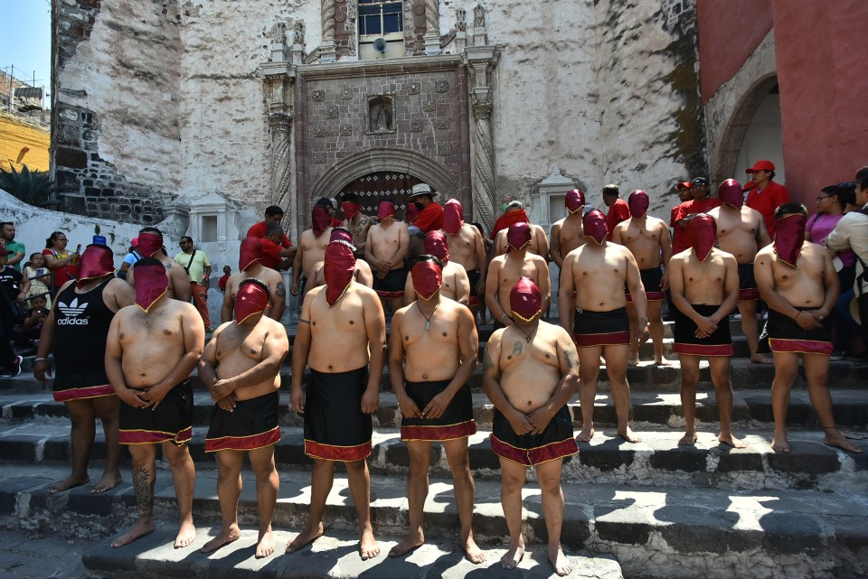 Men line up in preparation for their march down the town centre