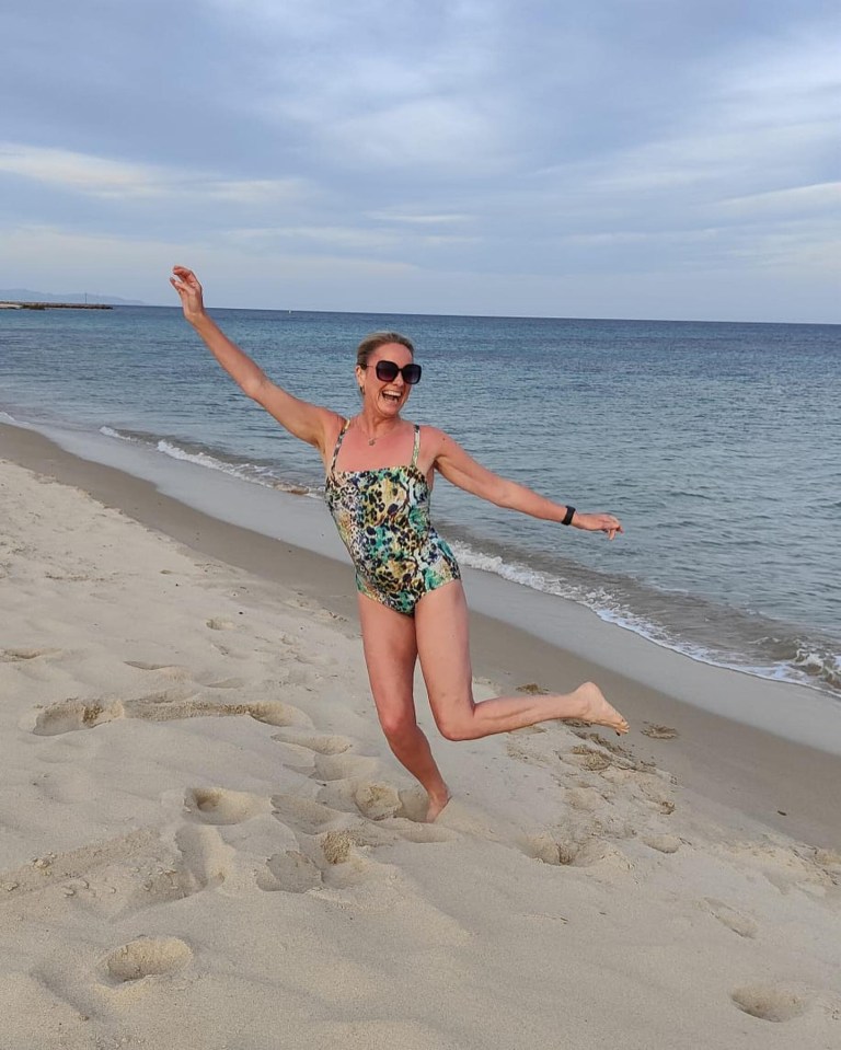 Tamzin posed in her eye-catching swimsuit on the sand