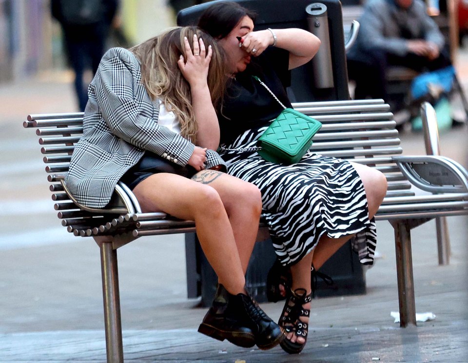 Partygoers looked a bit worse for wear sitting on a bench