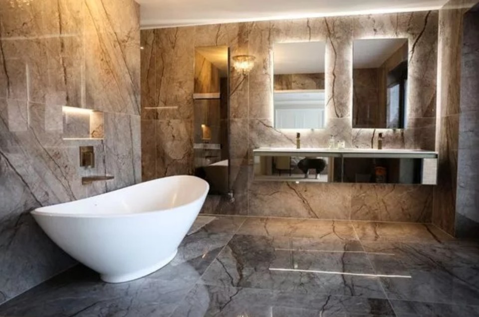 The couple's home boasts an opulent bathroom space