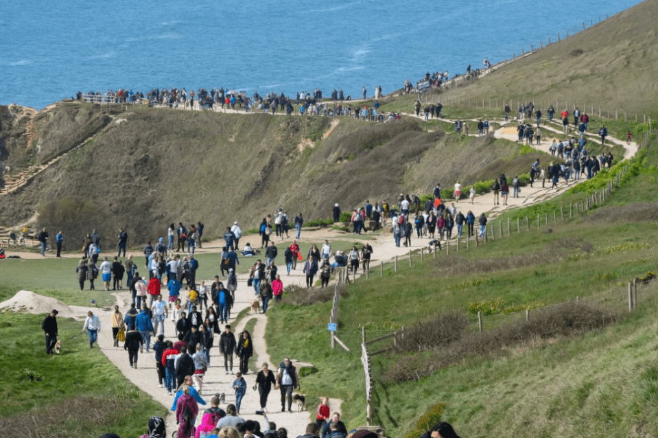 Hundreds of people came to enjoy the warm spring weather in Durdle Door, Dorset