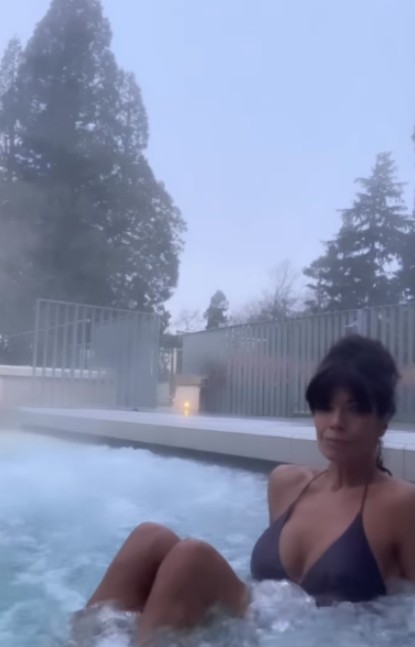 The TV presenter relaxed as she took a dip in a rooftop pool