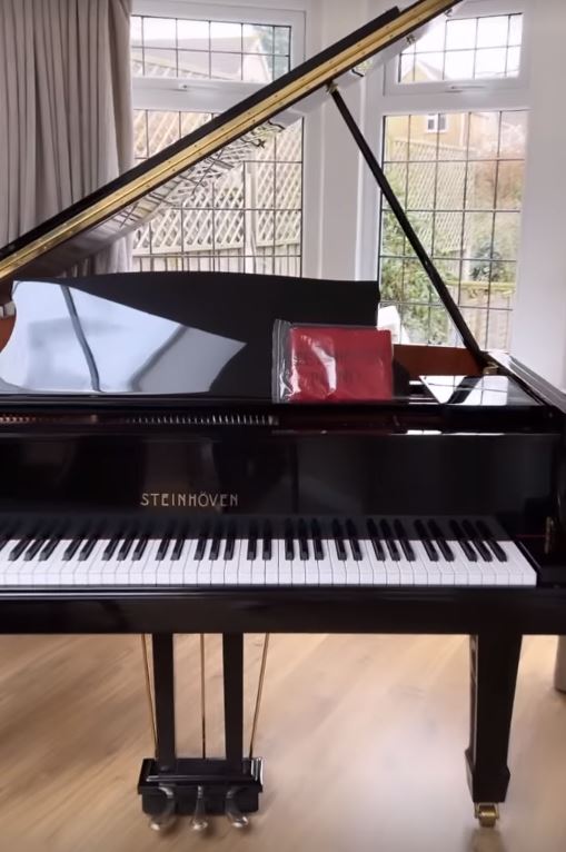 The IBF champ's house features a huge piano