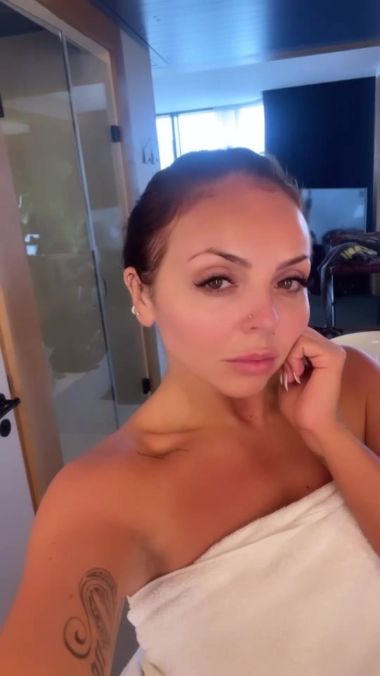 Jesy Nelson posed in just a towel before showing off her abs in a revealing video