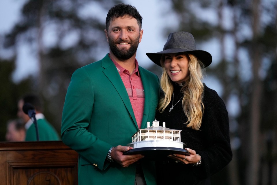 Jon Rahm holds the elite trophy with his stunning Wag Kelley Cahill