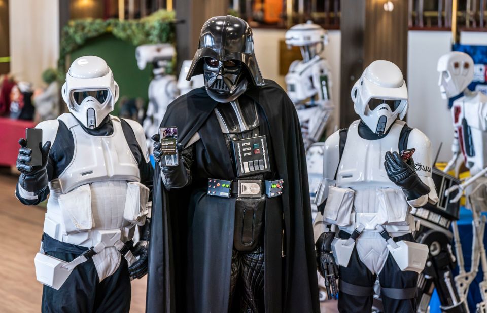 Members of the Sentinel Squad UK dressed as Darth Vader and Stormtroopers with their mobile phones during the test