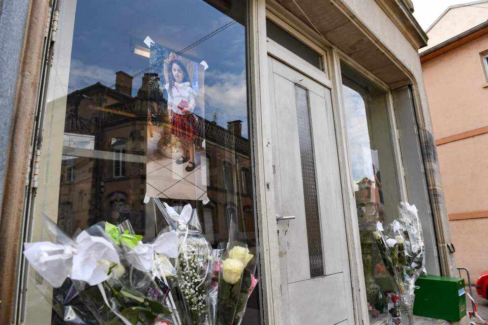 A picture of Rose in the window of her family's home