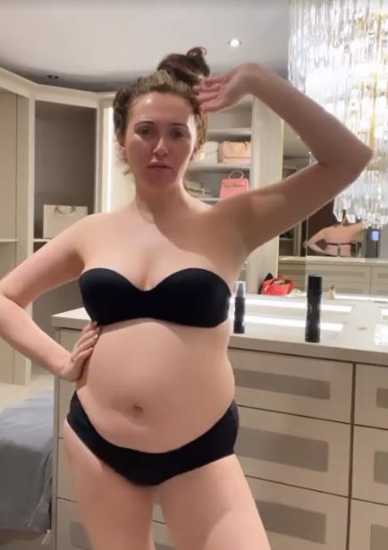 Pregnant Charlotte Dawson showed off her baby bump during a tanning session