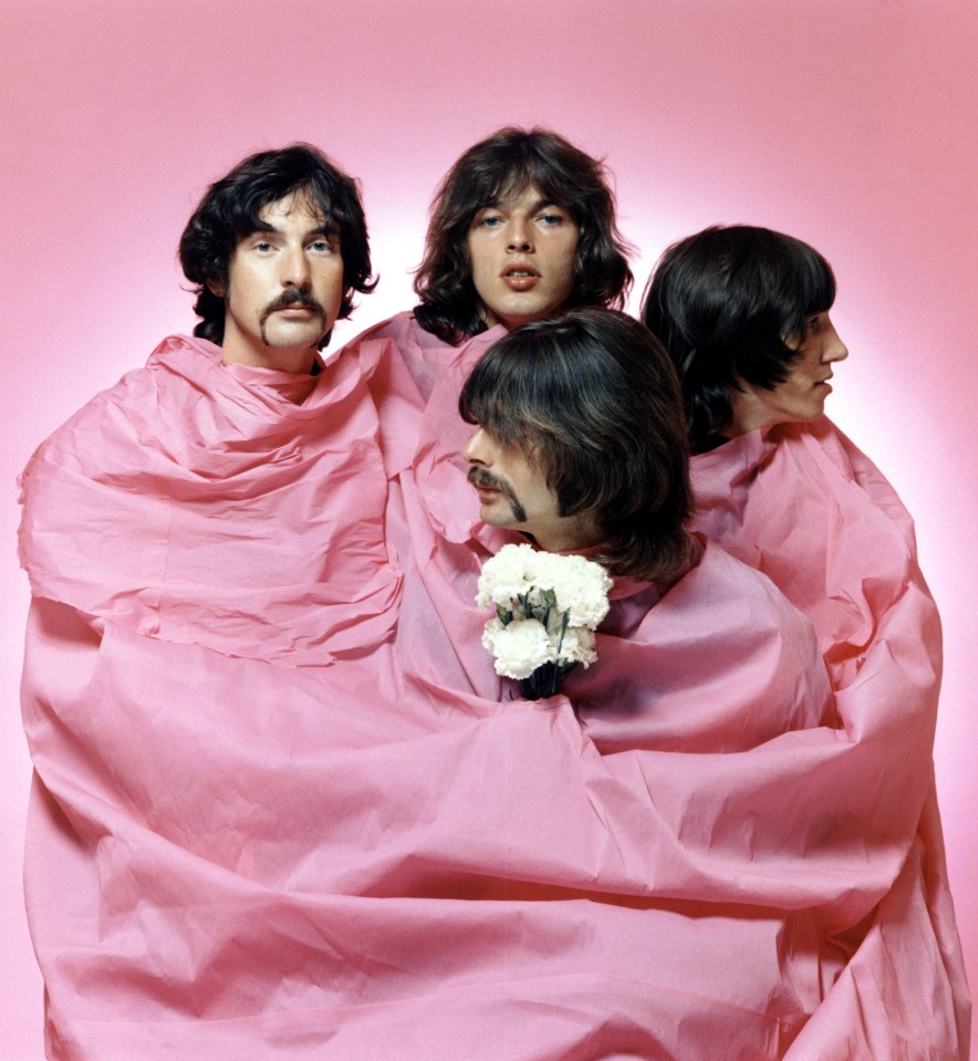 Pink Floyd pose for a portrait shrouded in pink in August 1968