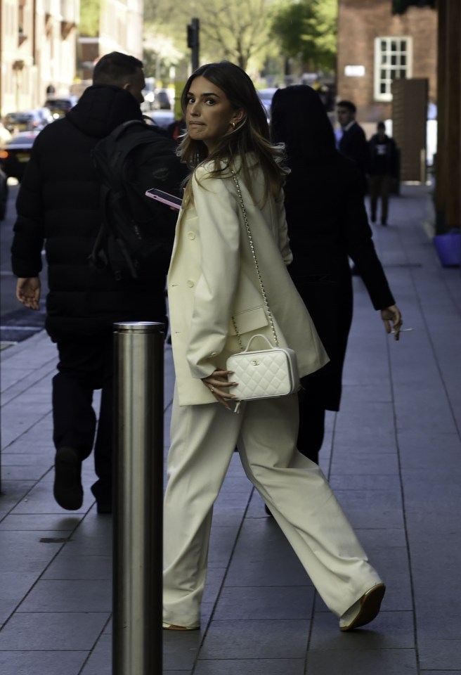 Sasha Attwood was snapped in a glamorous cream outfit and Chanel bag