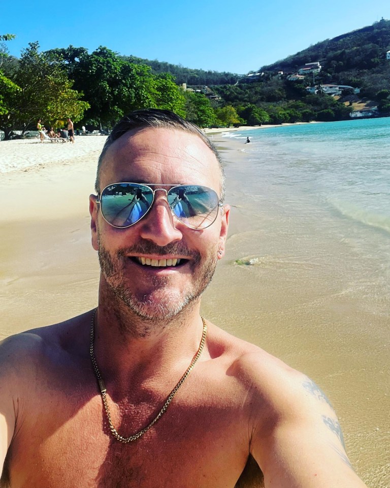 Will posed for photos on the white sand beach