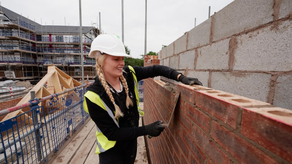 Despite the huge pay-packets on offer there's a chronic shortage of brickies in Britain - pictured Jeorgia building a bright future