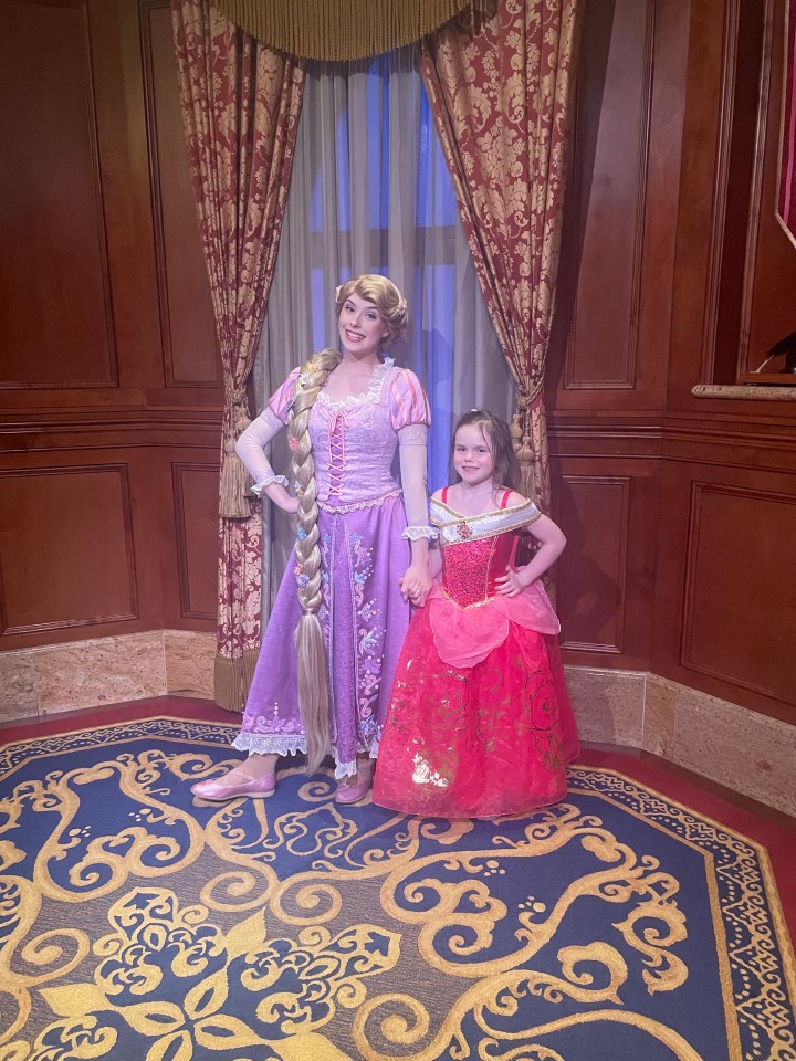 She still got her photos dressed with the princesses too