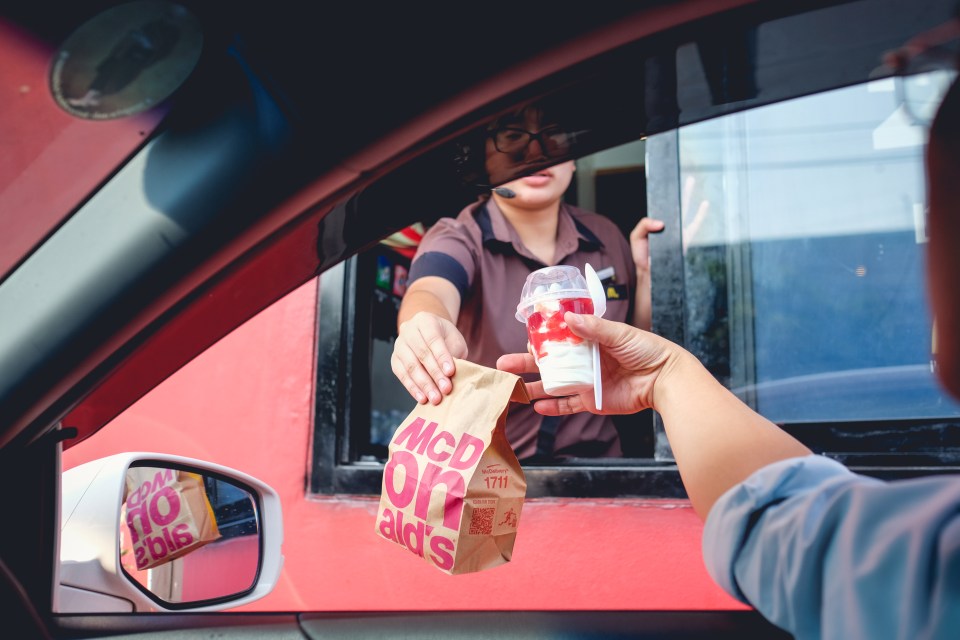 Many motorists waiting for their fix at the McDonald's drive-thru window are unaware of a costly road law