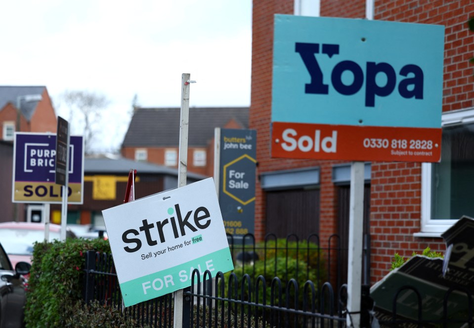 A view of for sale signs in Northwich, Britain, April 13, 2023. REUTERS/Molly Darlington