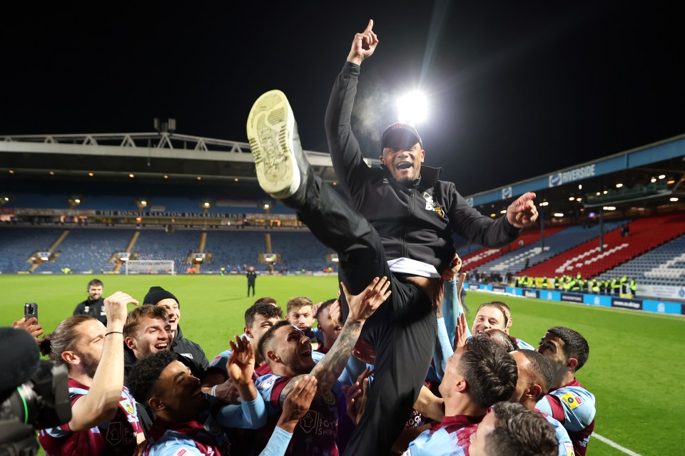 Ecstatic Burnley stars threw boss Vincent Kompany into the air