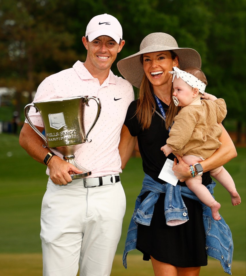 Rory McIlroy celebrates winning the 2021 Wells Fargo Championship alongside wife Erica Stoll and their daughter Poppy